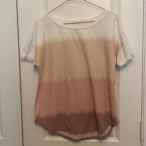 Medium T-shirt. Very comfortable!